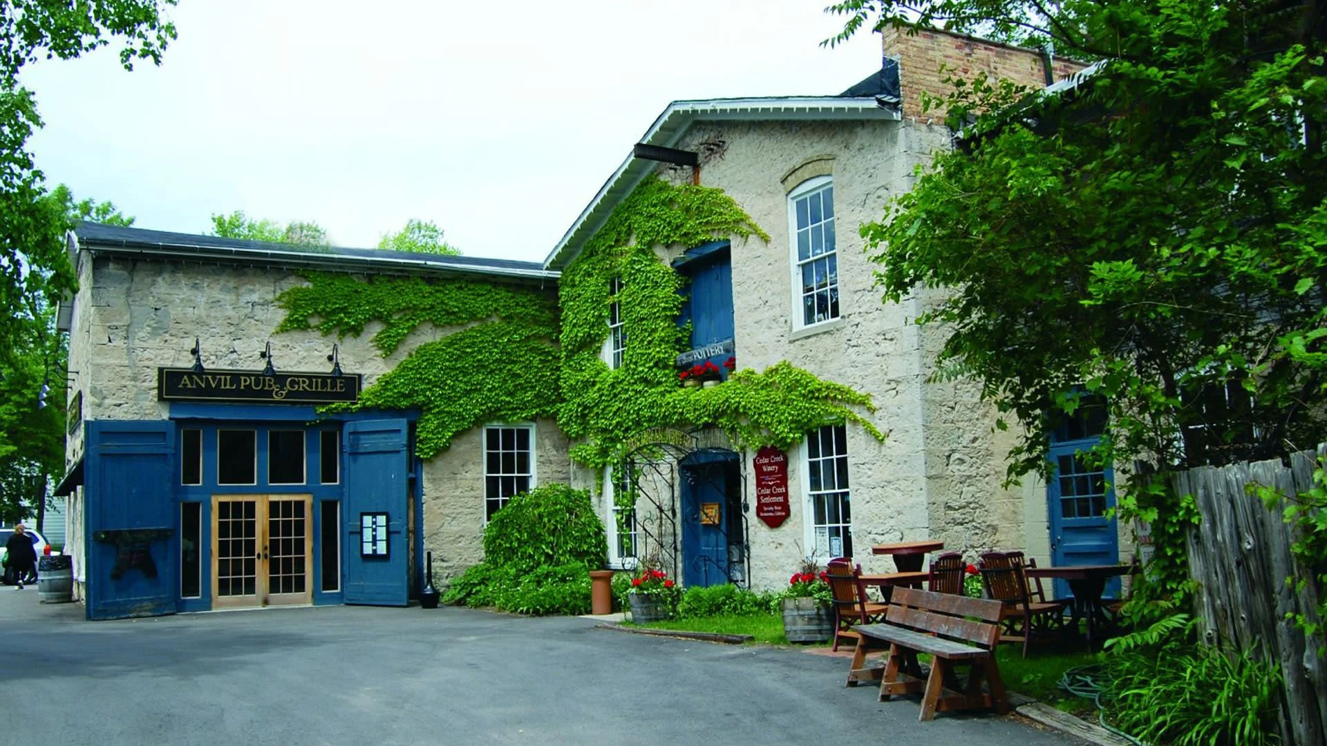 The ivy-covered stone mill at Cedar Creek Settlement, home of Cedar Creek Winery